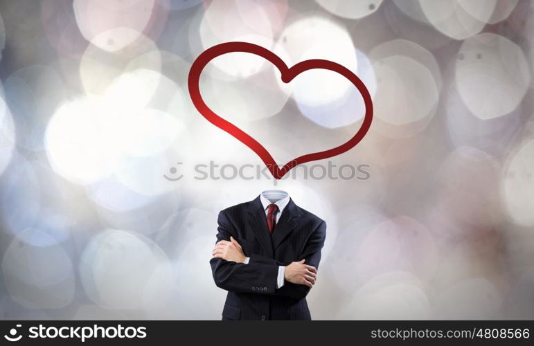 That love feeling. Faceless businessman with heart instead of head