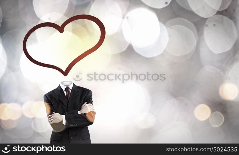 That love feeling. Faceless businessman with heart instead of head