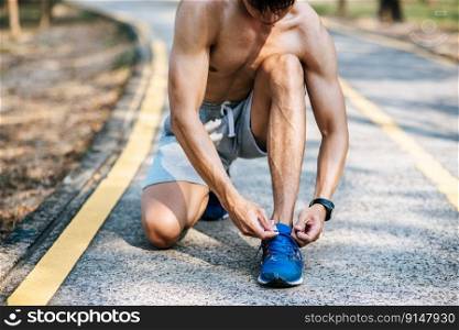 That man laced a shoelace to exercise. Selective focus.