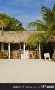 Thatched roof restaurant on the beach, West Bay Beach, Roatan, Bay Islands, Honduras