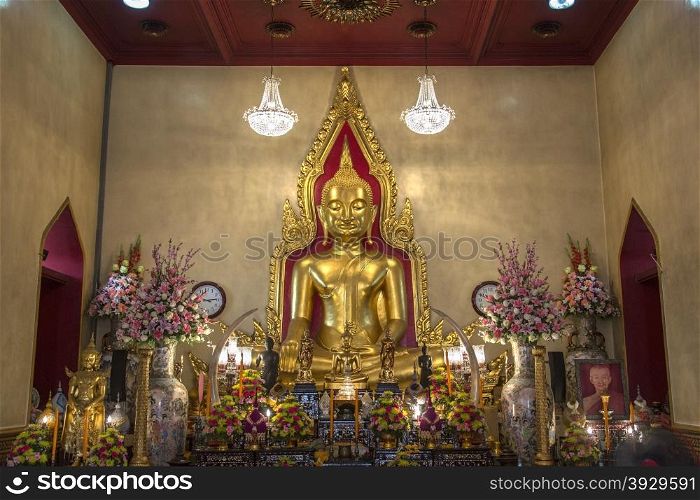 The 13th century solid gold Buddha within Wat Traimit in the Chinatown area of Bangkok in Thailand.