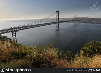"The "25 de Abril" bridge in Lisbon (Portugal) a copy of the Golden Gate bridge."