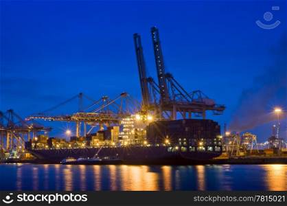The activity of loading and unloading of huge container ships at the world&rsquo;s biggest and busiest container harbor in Rotterdam
