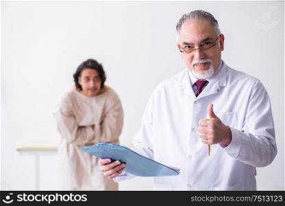 The aged male doctor psychiatrist examining young patient. Aged male doctor psychiatrist examining young patient