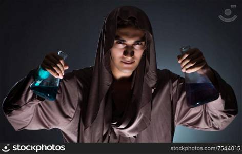 The alchemist doing experiments in alchemy concept. Alchemist doing experiments in alchemy concept