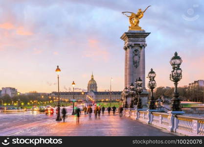 The Alexander III Bridge across Seine river in Paris, France at sunrise