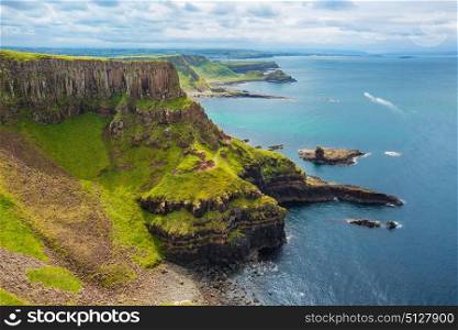 The Amphitheatre, Port Reostan Bay and Giant&rsquo;s Causeway on background, County Antrim, Northern Ireland, UK. view on Amphitheatre, Port Reostan Bay and Port Noffer Bay with Giant&rsquo;s Causeway on background, County Antrim, Northern Ireland, UK