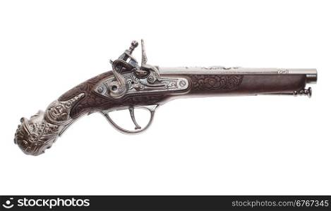 The ancient pistol isolated on white background