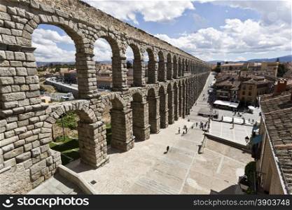 The ancient roman aqueduct bridge in Segovia, Spain.