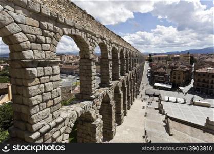The ancient roman aqueduct bridge in Segovia, Spain.