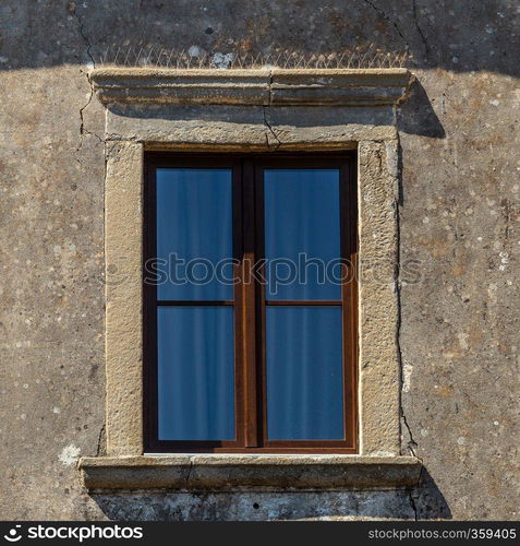 The  ancient window on stone wall, for background