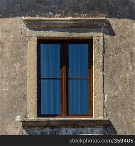 The  ancient window on stone wall, for background