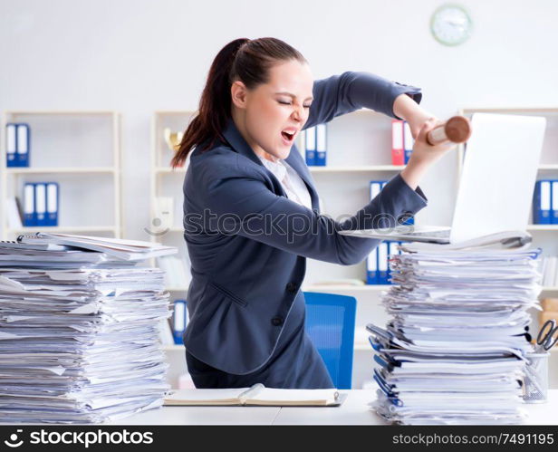 The angry businesswoman with baseball bat in office. Angry businesswoman with baseball bat in office