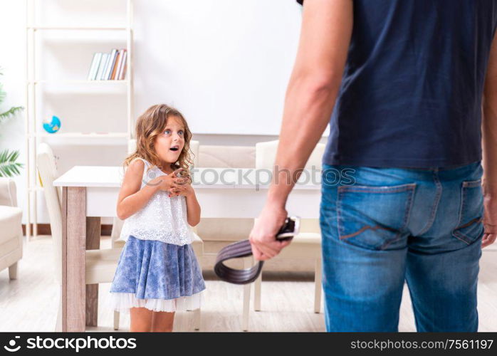 The angry father punishing his daughter. Angry father punishing his daughter