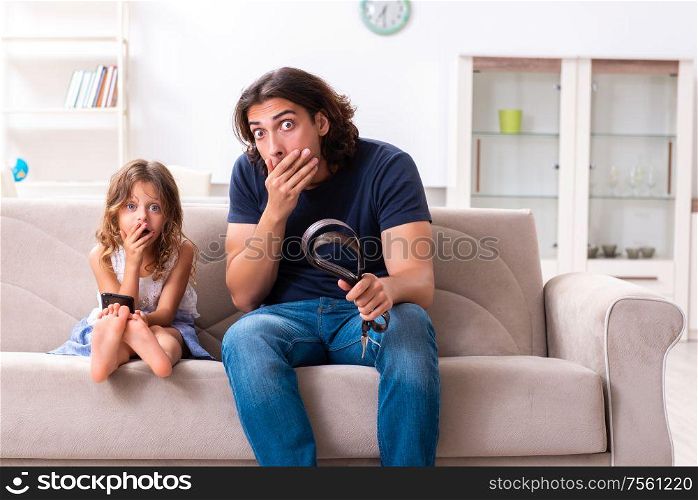 The angry father punishing his daughter. Angry father punishing his daughter