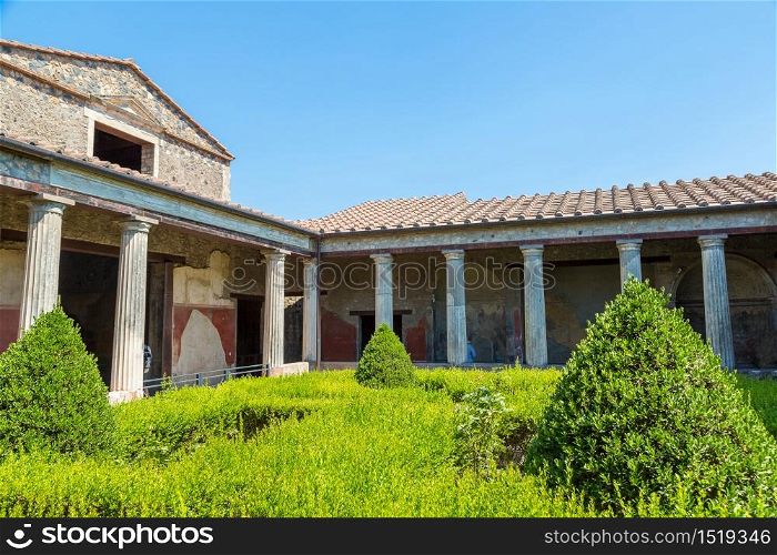 The antique villa in Pompeii city destroyed in 79BC by the eruption of volcano Vesuvius, Italy in a beautiful summer day