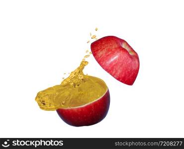 The apples is cut into two parts and the apple juice is splash on white
