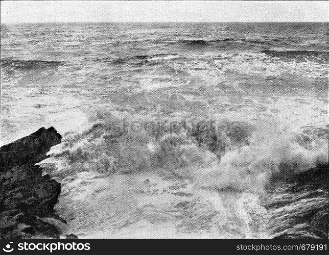 The approach of the waves by rough seas, vintage engraved illustration. From the Universe and Humanity, 1910.