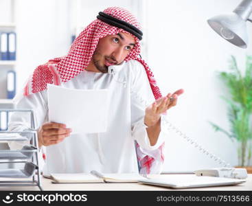 The arab businessman working in the office. Arab businessman working in the office