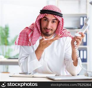 The arab businessman working in the office. Arab businessman working in the office