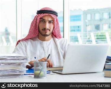 The arab businessman working in the office. Arab businessman working in the office