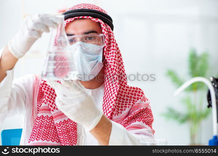 The arab chemist checking the quality of drinking water. Arab chemist checking the quality of drinking water