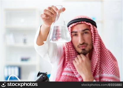 The arab chemist checking the quality of drinking water. Arab chemist checking the quality of drinking water