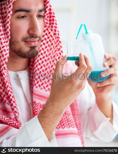 The arab chemist checking the quality of drinking water. Arab chemist checking the quality of drinking water