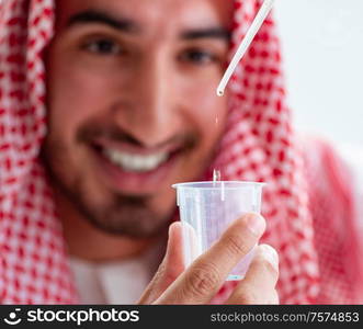 The arab chemist checking the quality of drinking water. Arab chemist checking the quality of drinking water