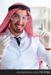 The arab chemist scientist testing quality of oil petrol. Arab chemist scientist testing quality of oil petrol