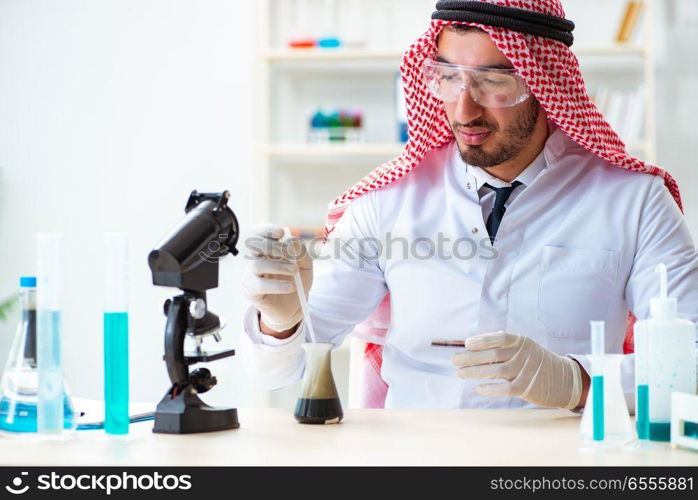 The arab chemist working in the lab office. Arab chemist working in the lab office