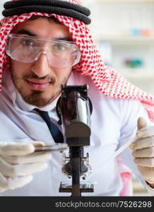 The arab chemist working in the lab office. Arab chemist working in the lab office