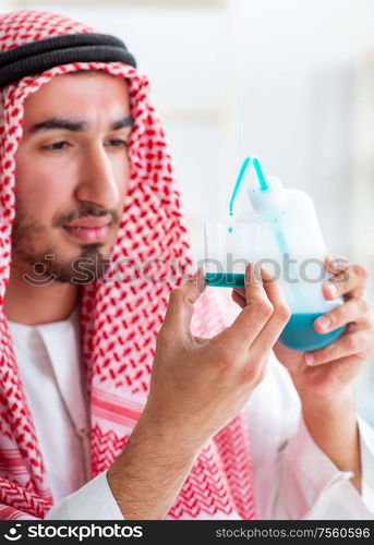 The arab chemist working in the lab office. Arab chemist working in the lab office