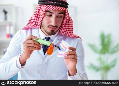 The arab dentist working on new teeth implant. Arab dentist working on new teeth implant