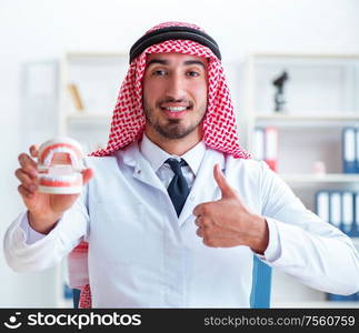 The arab dentist working on new teeth implant. Arab dentist working on new teeth implant