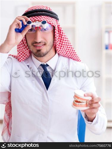 The arab dentist working on new teeth implant. Arab dentist working on new teeth implant
