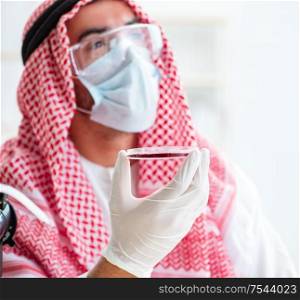The arab doctor chemist studying new virus in lab. Arab doctor chemist studying new virus in lab
