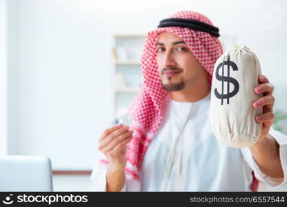 The arab man with bitcoin in cryptocurrency mining concept. Arab man with bitcoin in cryptocurrency mining concept