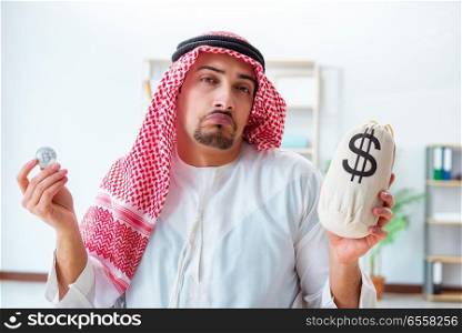 The arab man with bitcoin in cryptocurrency mining concept. Arab man with bitcoin in cryptocurrency mining concept