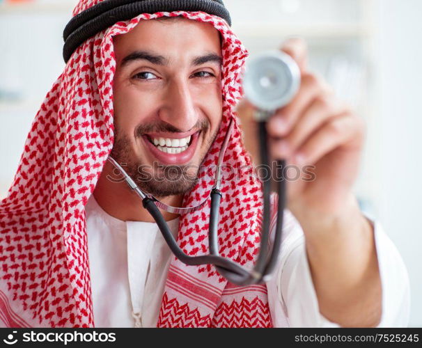 The arab saudi doctor with stethoscope in hospital. Arab saudi doctor with stethoscope in hospital