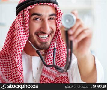 The arab saudi doctor with stethoscope in hospital. Arab saudi doctor with stethoscope in hospital