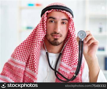 The arab saudi doctor with stethoscope in hospital. Arab saudi doctor with stethoscope in hospital