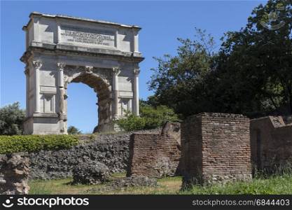 The Arch of Titus in the Roman Forum in the city of Rome, Italy. It was constructed in AD 82 by the Emperor Domitian. It was the inspiration for the Arc de Triomphe in Paris, France. Arch of Titus - Roman Forum - Rome - Italy