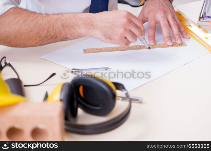 The architect working in his studio on new project. Architect working in his studio on new project