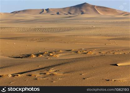 The arid landscape and sand dunes of the Namib Desert in Namibia, Africa.