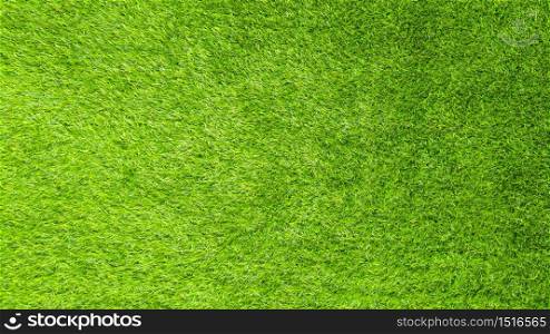 The artificial green grass pattern texture background.