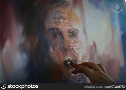 The artist paints a portrait of oil on canvas