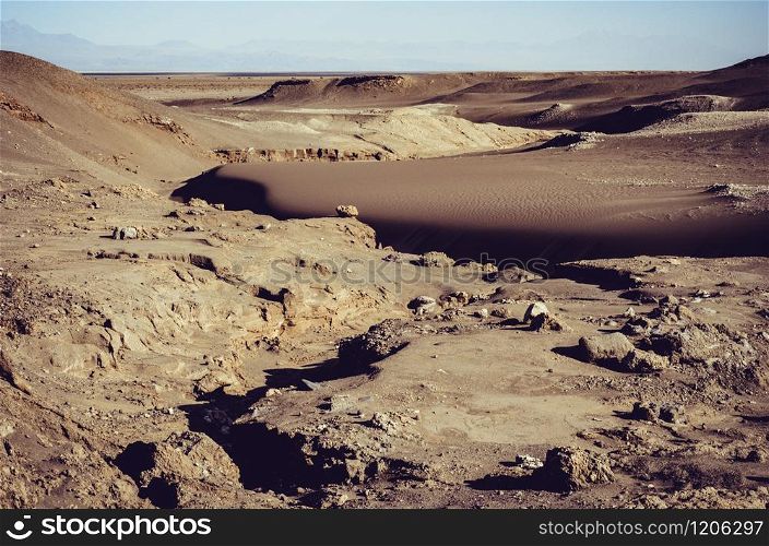 The Atacama desert is one of the driest places in the world, as well as the only true desert to receive less precipitation than the polar deserts. Desert sand, rocks and details in Atacama, Chile
