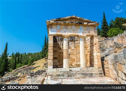 The Athenian treasury in Delphi, Greece in a summer day