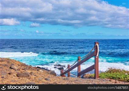 The Atlantic Ocean and rocky coast of Tenerife island with footpath to the water, The Canaries - Landscape, seascape